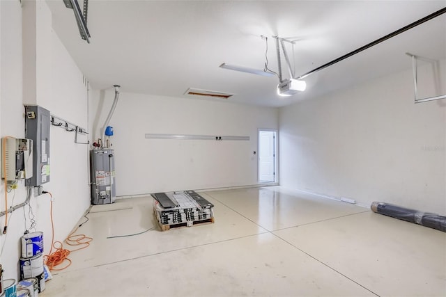 garage with gas water heater, electric panel, and a garage door opener
