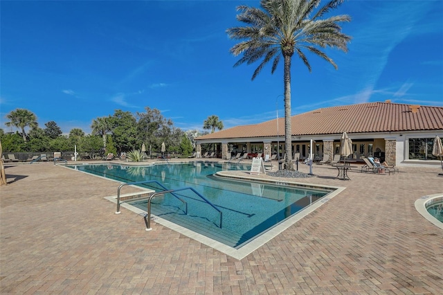 community pool with a patio