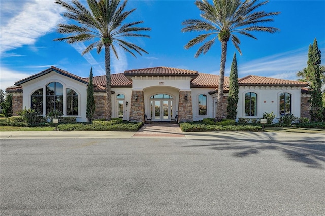 12822 Del Corso Loop, Bradenton, FL 34211 - mediterranean / spanish-style home featuring french doors, stucco siding, and stone siding