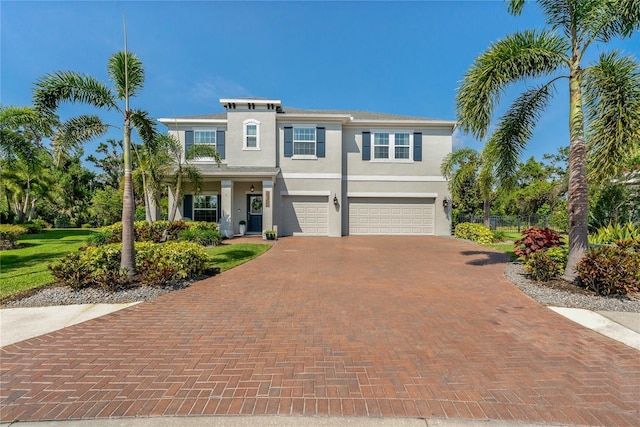 5805 49th Ct E, Ellenton, FL 34222 - view of front of house with an attached garage, fence, decorative driveway, and stucco siding