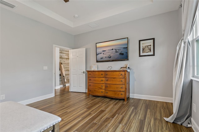 5805 49th Ct E, Ellenton, FL 34222 - bedroom featuring a raised ceiling, wood finished floors, and baseboards