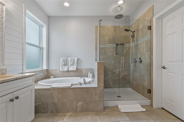 5805 49th Ct E, Ellenton, FL 34222 - bathroom featuring a shower stall, a garden tub, vanity, and tile patterned flooring