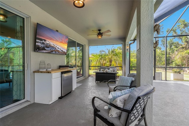 5805 49th Ct E, Ellenton, FL 34222 - view of patio featuring a ceiling fan, a lanai, and an outdoor kitchen