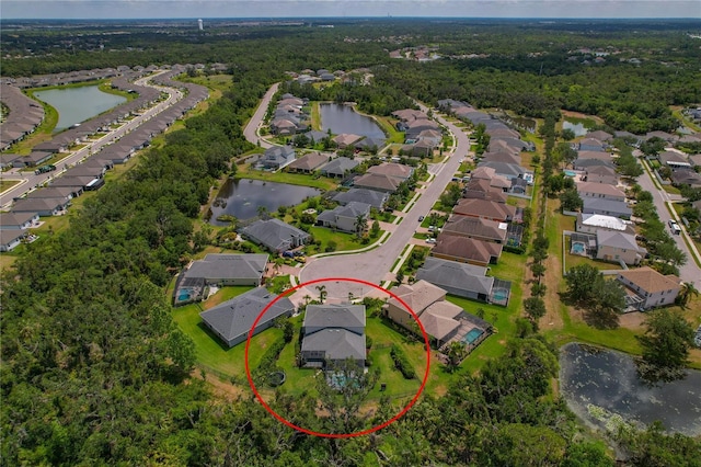 5805 49th Ct E, Ellenton, FL 34222 - aerial view of residential area featuring a nearby body of water and a heavily wooded area
