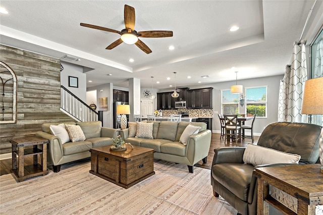 5805 49th Ct E, Ellenton, FL 34222 - living area with ceiling fan, stairs, recessed lighting, light wood finished floors, and a raised ceiling