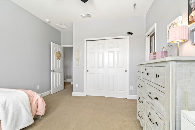 5805 49th Ct E, Ellenton, FL 34222 - bedroom with light colored carpet, a closet, and baseboards