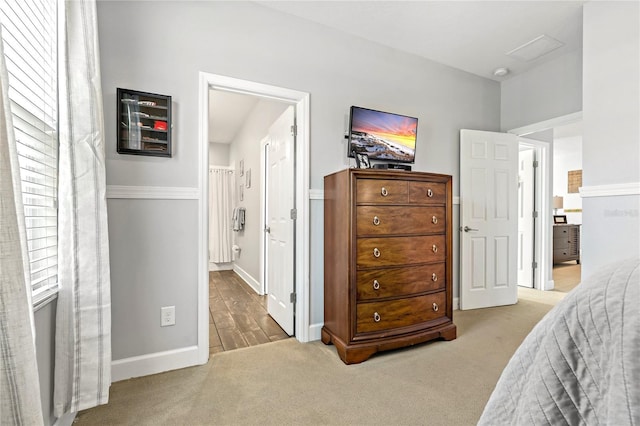 5805 49th Ct E, Ellenton, FL 34222 - carpeted bedroom with baseboards and ensuite bath