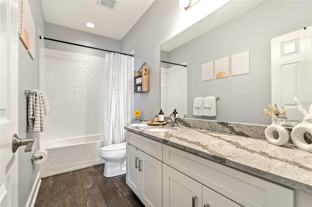 5805 49th Ct E, Ellenton, FL 34222 - full bath with wood-type flooring, toilet, shower / tub combo, and vanity