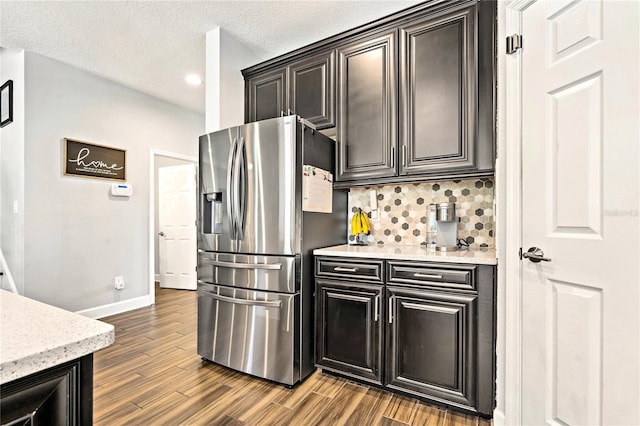 5805 49th Ct E, Ellenton, FL 34222 - kitchen with stainless steel fridge, baseboards, dark wood finished floors, tasteful backsplash, and recessed lighting