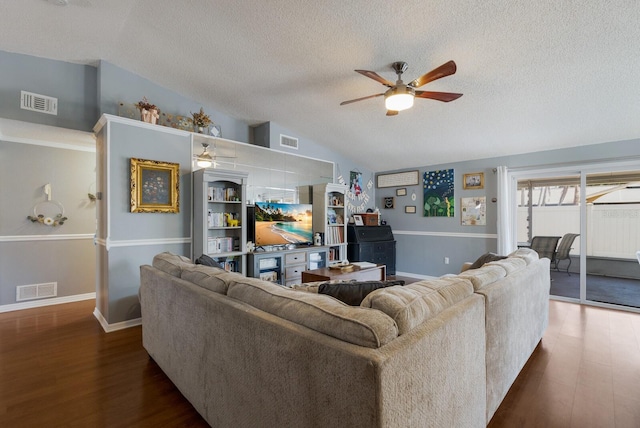 living room with ceiling fan, a textured ceiling, vaulted ceiling, dark wood finished floors, and baseboards