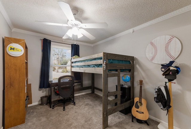 carpeted bedroom with ornamental molding, a desk, a textured ceiling, baseboards, and ceiling fan