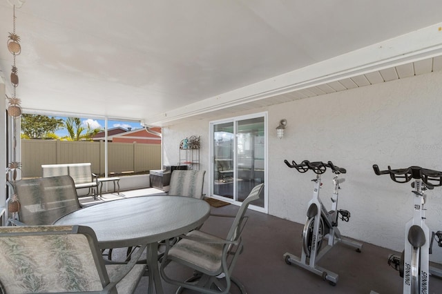 view of patio featuring fence and outdoor dining area