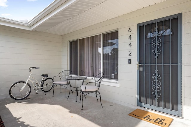 6442 Colonial Dr, Sarasota, FL 34231 - doorway to property with covered porch