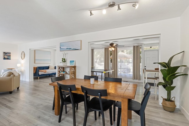 6442 Colonial Dr, Sarasota, FL 34231 - dining area with light wood-style flooring, ceiling fan, and baseboards