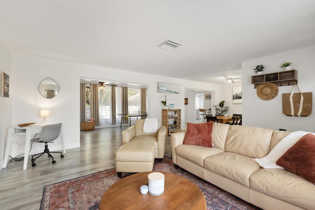 6442 Colonial Dr, Sarasota, FL 34231 - living area featuring light wood-style floors and a desk