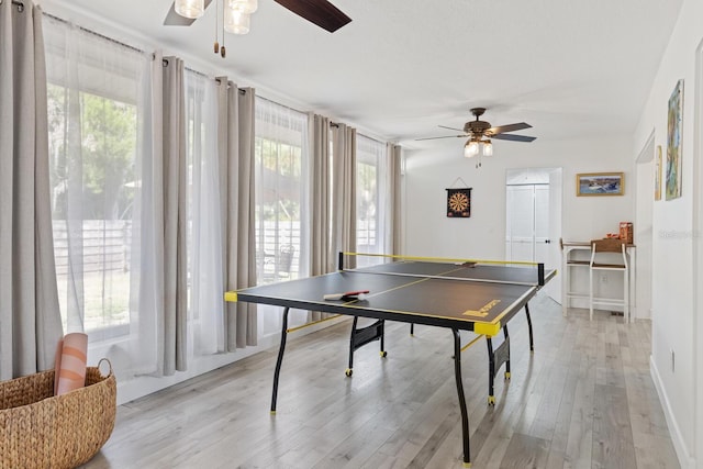 6442 Colonial Dr, Sarasota, FL 34231 - game room with ceiling fan, plenty of natural light, and light wood-style flooring