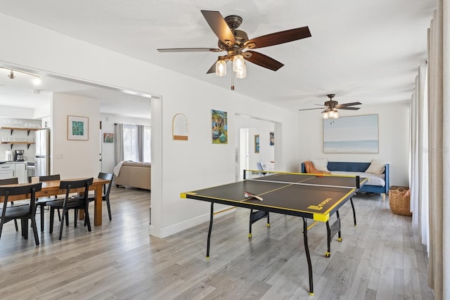 6442 Colonial Dr, Sarasota, FL 34231 - playroom with light wood-style floors, a ceiling fan, and baseboards