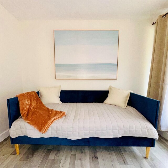 6442 Colonial Dr, Sarasota, FL 34231 - bedroom featuring wood finished floors and baseboards