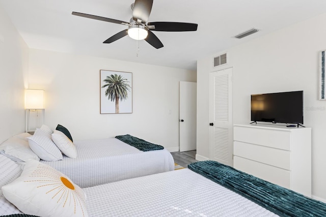 6442 Colonial Dr, Sarasota, FL 34231 - bedroom featuring wood finished floors, ceiling fan, and baseboards