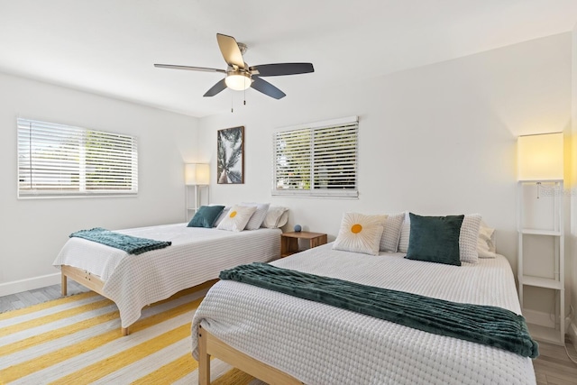 6442 Colonial Dr, Sarasota, FL 34231 - bedroom featuring light wood-style flooring, baseboards, and a ceiling fan