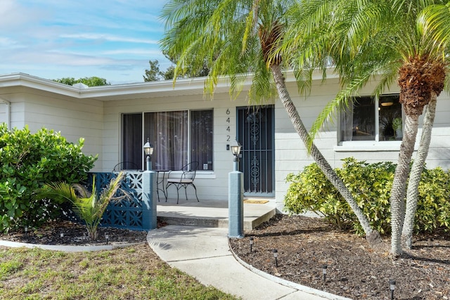 6442 Colonial Dr, Sarasota, FL 34231 - property entrance featuring a porch
