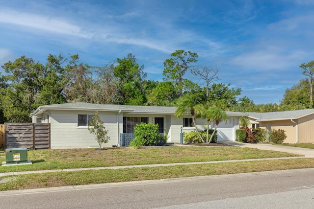 6442 Colonial Dr, Sarasota, FL 34231 - ranch-style home with driveway and an attached garage