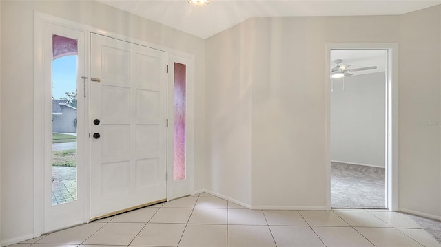 5004 32nd St E, Bradenton, FL 34203 - entrance foyer featuring baseboards, light tile patterned flooring, and ceiling fan