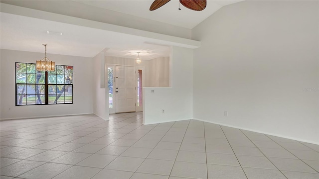 5004 32nd St E, Bradenton, FL 34203 - spare room featuring a ceiling fan, a chandelier, light tile patterned floors, lofted ceiling, and baseboards