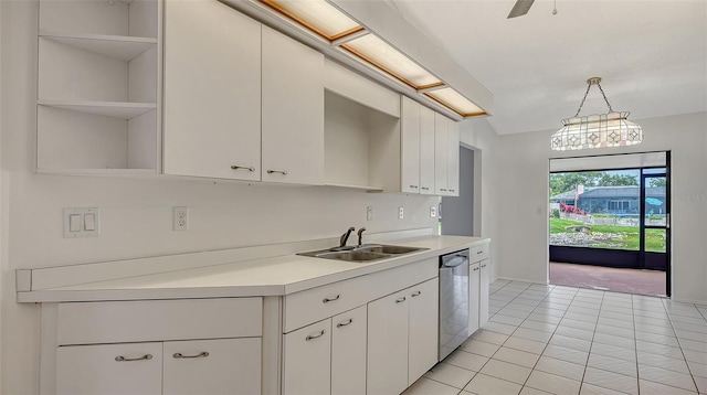 5004 32nd St E, Bradenton, FL 34203 - kitchen with a sink, dishwasher, open shelves, light countertops, and white cabinetry