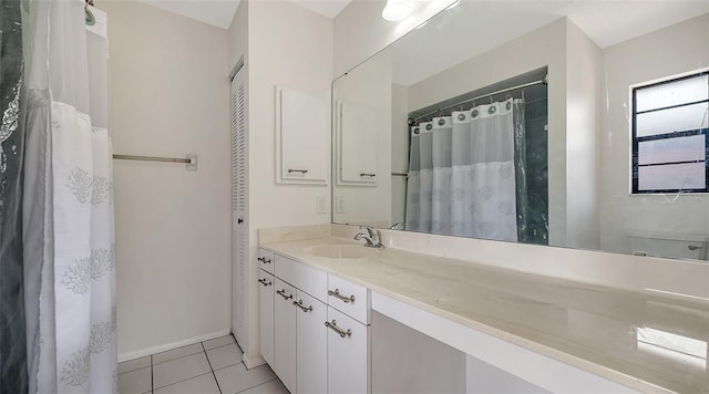 5004 32nd St E, Bradenton, FL 34203 - full bath with tile patterned floors, vanity, and a shower with shower curtain
