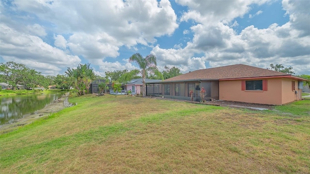 5004 32nd St E, Bradenton, FL 34203 - back of property featuring a yard, a water view, and stucco siding