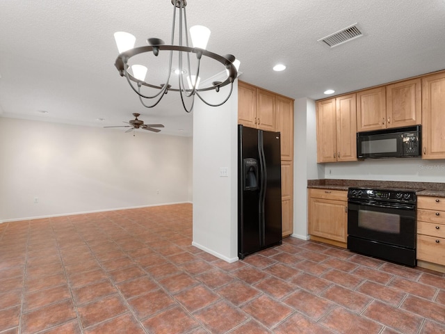 635 N Jefferson Ave Unit 635, Sarasota, FL 34237 - kitchen with black appliances, a chandelier, a textured ceiling, dark countertops, and baseboards