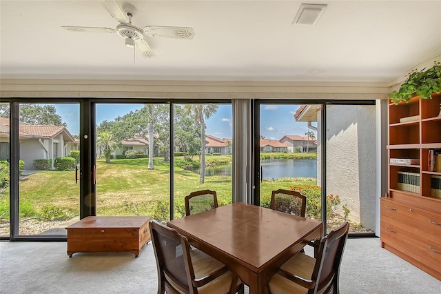 6096 Wilshire Blvd Unit 9, Sarasota, FL 34238 - sunroom featuring a water view and a residential view