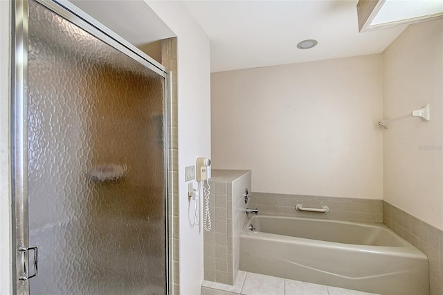 6096 Wilshire Blvd Unit 9, Sarasota, FL 34238 - bathroom featuring a garden tub, tile patterned flooring, and a shower stall