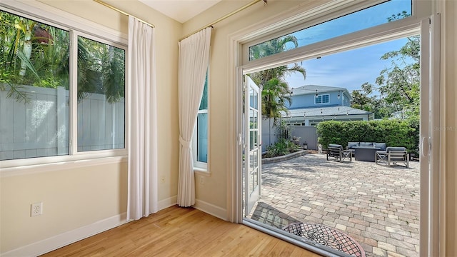 1934 Bougainvillea St, Sarasota, FL 34239 - doorway with baseboards and wood finished floors