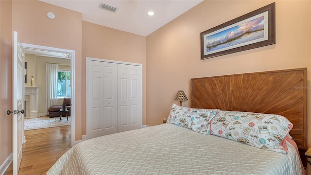 1934 Bougainvillea St, Sarasota, FL 34239 - bedroom featuring wood finished floors, baseboards, a closet, and recessed lighting