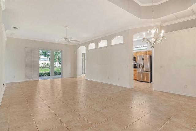 spare room with light tile patterned flooring, baseboards, arched walkways, a chandelier, and ornamental molding