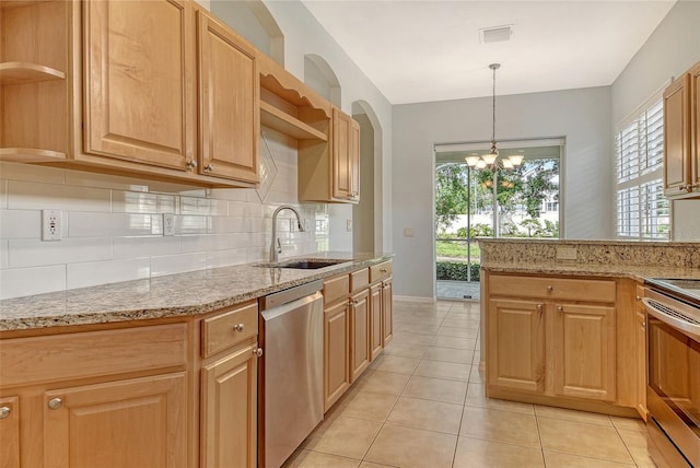 kitchen with open shelves, a sink, appliances with stainless steel finishes, tasteful backsplash, and light stone counters