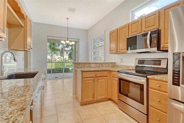 kitchen with stainless steel appliances, a sink, a chandelier, light stone counters, and a peninsula