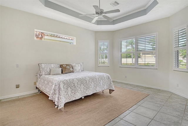 bedroom with multiple windows, light tile patterned floors, baseboards, ceiling fan, and ornamental molding