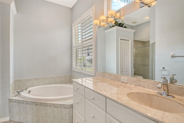 full bath with vanity, a stall shower, a bath, and toilet