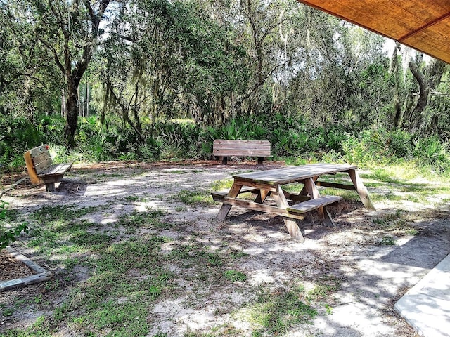 view of yard with outdoor dining space