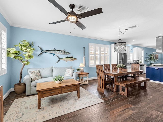dining area with ornamental molding, a ceiling fan, plenty of natural light, baseboards, and recessed lighting