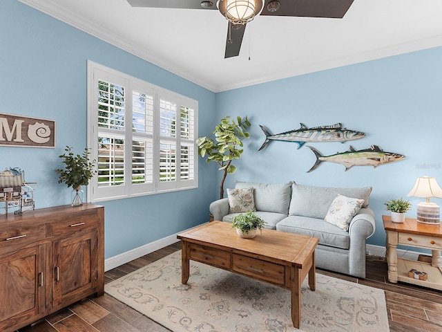 living room featuring ornamental molding, wood finished floors, baseboards, and a ceiling fan
