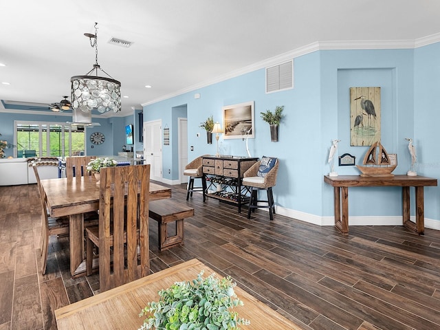 dining space featuring crown molding, baseboards, dark wood finished floors, a chandelier, and recessed lighting
