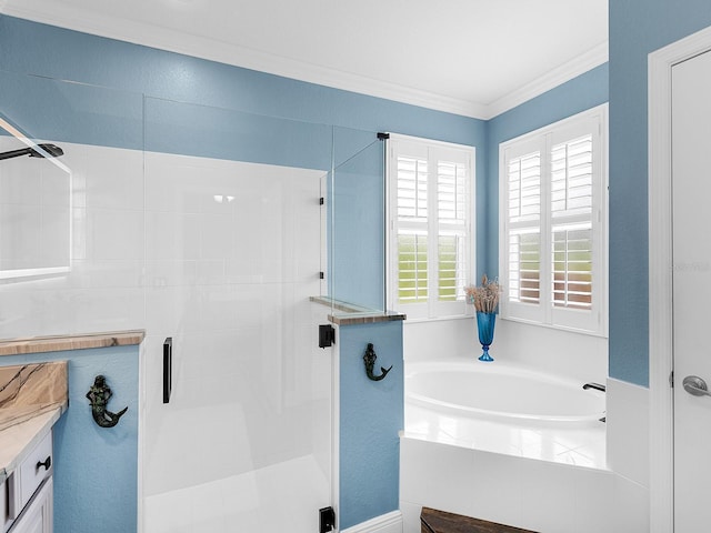 full bath with a shower stall, a bath, ornamental molding, and vanity