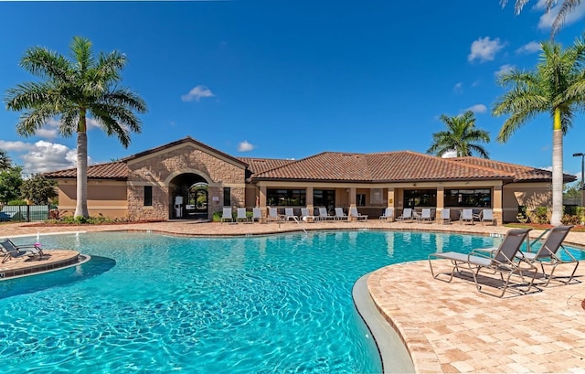 community pool with a patio area