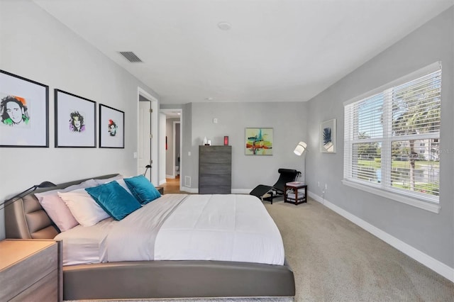 3430 77th St W Unit 103, Bradenton, FL 34209 - bedroom featuring baseboards and light colored carpet