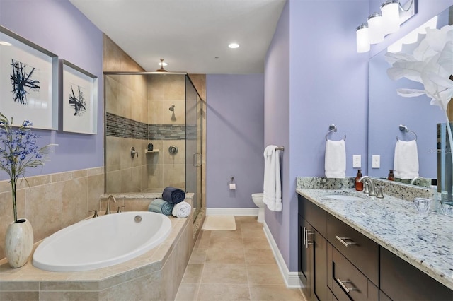 3430 77th St W Unit 103, Bradenton, FL 34209 - bathroom with vanity, a shower stall, a bath, tile patterned floors, and toilet