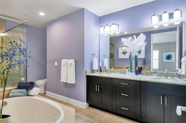 3430 77th St W Unit 103, Bradenton, FL 34209 - full bathroom featuring a stall shower, baseboards, tile patterned flooring, double vanity, and a tub